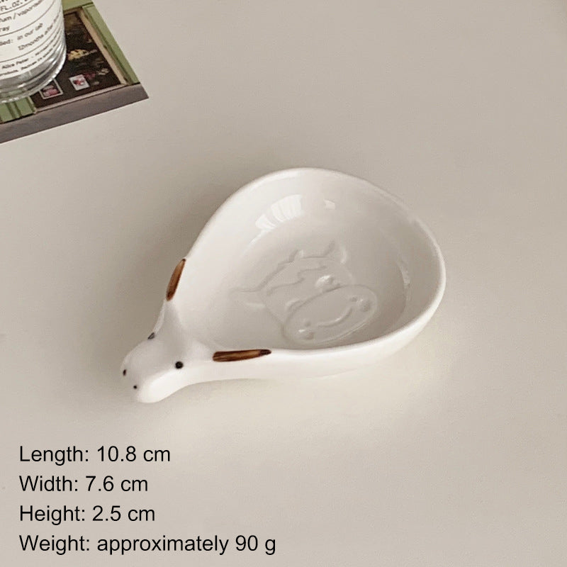Cute household condiment dish with embossed design, ceramic vinegar dish, and various dipping sauces.