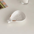 Cute household condiment dish with embossed design, ceramic vinegar dish, and various dipping sauces.